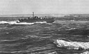 A PT maneuvers off the German fort at Cherbourg to see if its guns are still active