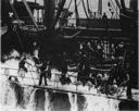 Neosho refuels Yorktown (CV-5) just prior to the Battle of the Coral Sea. Note the difficulty the crew was having while trying to work in the heavy seas smashing over the well deck (one seaman in the center has even fallen down). Problems such as these led to the universal adoption of the elevated cargo spar decks for winches and other handling gear. (National Archives)