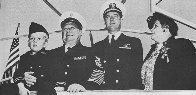Three generations: Master E.V., 
Chief Radioman and Mrs. E.G.V., Lcdr E.C. Schneider