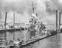 Image: 80-G-32769 USS Shaw in Floating Drydock Number Two, showing damage after magazine explosion demolished the ship just forward of the bridge.