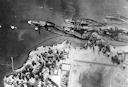 Image: 80-G-387572 Aerial view of Battleship Row. From left to right: Arizona, Tennessee (inboard) and West Virginia, Maryland and Oklahoma (capsized).