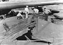 Image: USN NR&L (MOD) 39749 USS Nevada, showing bomb rupture on bow, forward of turret I.