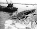 Image: USN NR&L (MOD) 39757 Pontoons surfacing near bow of Oglala, 11 April 1942.