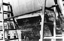 Image: USN NR&L (MOD) 39762 USS Nevada in drydock, showing window frame patch in place.