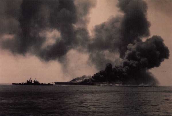 Smoke billows into the sky from Bunker Hill (CV 17).