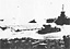 Beach and Surf Conditions Wrecked Numerous barges. Uncollected Cargo Nets
on the Beach Went Adrift and Fouled Propellers of Small Craft