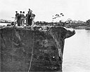 Photo 13-2: GROWLER (SS215). General view from starboard forward showing collision damage to bow