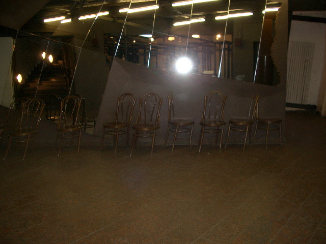 Chairs melting into the wall and floor