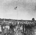 The Marine Corps band plays the national anthem as the flag is
raised at the dedication of Ray Enouf Field, Klamath Agency, Oregon.
The airfield is named in honor of the only Klamath Indian to lose his
life in World War II, a Marine private first class, who was killed while
acting as first-aid man in the front lines on Iwo Jima. Ceremonies
dedicating the field took place on September 27, 1945.