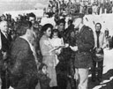 In a formal ceremony at Laguna Pueblo, Mrs. Frank Paisano, Jr., accepts the
Air Medal awarded to her husband, a prisoner of war in Germany. Lt. Paisano was 
later released and returned home.
