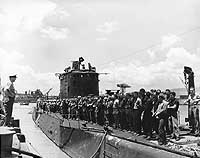 Photo # 80-G-11740:  USS Argonaut docks at Pearl Harbor after the Makin raid, 26 August 1942