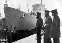 Photo # 80-G-218861:  African-American crewmembers of USS Mason's look at their ship, 20 March 1944