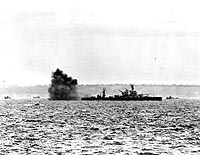Photo # 80-G-231250:  USS Arkansas fires her 12-inch guns during the Normandy invasion, 6 June 1944