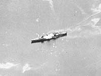 Photo # 80-G-31514 (cropped):  Japanese ship, probably Nisshin, firing on U.S. aircraft, 13 October 1942