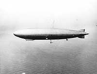 Photo # 80-G-461642: USS Los Angeles operating with an UO-1 airplane, 20 May 1930