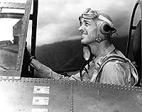 Photo # 80-G-64822: Lieutenant Commander John S. Thach in the cockpit of an F4F fighter plane, 5 May 1942