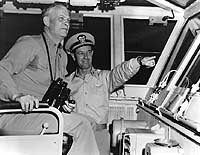 Photo # 80-G-687784: Admiral Arleigh A. Burke on the bridge of USS Forrestal, 12 March 1956.  Photographed by H.L. Wise.