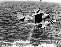 Photo # 80-G-79418: Curtiss SOC-1 is recovered by its parent cruiser, July 1943