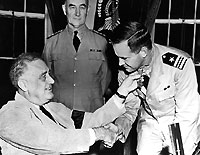 Photo # NH 44324:  Lieutenant Commander John D. Bulkeley receives the Medal of Honor from President Franklin D. Roosevelt, 1942