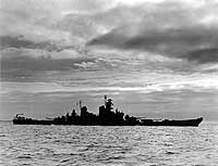 Photo # NH 45486:  USS New Jersey (BB-62) silhouetted against the sea and clouds, October 1943