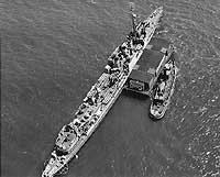 Photo #  NH 50143:  Barge Captain Jarvis and a tug alongside USS Tarbell, 24 July 1943.