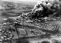 Photo # NH 50473:  Planes and hangars burning at Wheeler Army Air Field, photographed from an attacking Japanese plane during the Pearl Harbor raid, 7 December 1941.