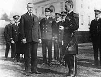 Photo # NH 52667:  LCdr. Walter A. Edwards receives the Medal of Honor from President Calvin Coolidge, 2 February 1924