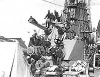 Photo # NH 60243:  Sailors and Marines posing on USS Virginia's after 'superposed' gun turret, circa 1910-14