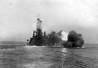Photo # NH 66299:  USS Michigan firing a broadside with ther main battery guns, 1912