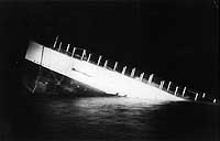 Photo # NH 69229:  USS S-4 sinking during an unsuccessful salvage test, December 1928