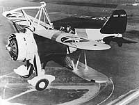 Photo # NH 77428: Curtiss F9C-2 in flight over Moffett Field, California, 1934