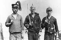 Photo # NH 85879:  USS Wickes' crewmen showing off with German helmets, swords and medals, 1919