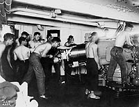 Photo # NH 93414:  USS Nevada crewmen exercising with one of the ship's five-inch guns, circa 1921.
