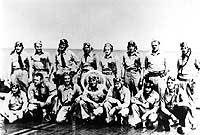 Photo # NH 93595: Lieutenant Commander John C. Waldron (standing, 3rd from left) with other pilots of Torpedo Squadron 8 on board USS Hornet shortly before the Battle of Midway