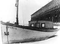 Photo #  NH 94482:  Fishing boat Doris in an icy harbor