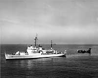 Photo #  NH 97640:  USS Greenwich Bay tending a P5M seaplane on 24 May 1955.