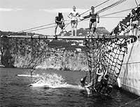 Photo #  NH 97755:  USS Greenwich Bay holds swim call off Capri, Italy, 1961.