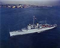 Photo # NH 97873-KN:  USNS Josiah Willard Gibbs passing commercial piers during the 1960s.