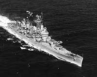 Photo # NH 98280:  USS Boston underway at sea, March 1956