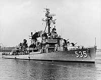 Photo # NH 98528:  USS Miller underway astern while in a harbor, circa the early 1960s