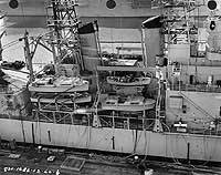 Photo # NH 98976:  Midships view of USS Little Rock, during an inclining experiment at Philadelphia, Pennsylvania, December 1960