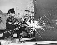 Photo # NH 99043:  Mrs. Frank Knox christens USS Frank Knox at Bath, Maine, 17 Sept. 1944.  Photographed by Douglas