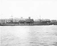 Photo # NH 99744:  USS Scania at Shanghai, China, 24 March 1946