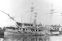 Photo # NH 101975:  USS Charles Mann, at the Boston Navy Yard, circa 1917-19, with USS Constitution in the background