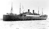Photo # NH 102878:  USS Mobile in New York Harbor, with her decks crowded with troops returning from Europe, 1919