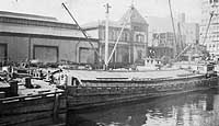 Photo #  NH 103544:  Barge Economy in port