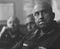 Photo # NH 104899:  Admiral Thomas H. Moorer listens to a briefing at Binh Thuy, Vietnam, August 1969.  Photographed by JOC Dick Benjamin.