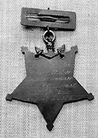 Photo # NH 105357:  Medal of Honor awarded to Quarter Gunner Henry (Charles) Baker, USN
