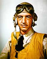 Photo # 80-G-K-14025: Lieutenant Commander John S. Thach wearing flight helmet, goggles and inflatable life vest, circa 1942-1943.