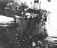 Photo # 19-N-11575:  USS Bainbridge rescues survivors of the burning transport Vinh-Long, 16 December 1922